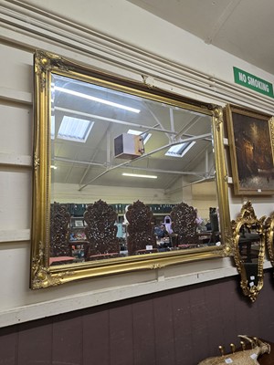 Lot 53 - A reproduction rectangular gilt framed bevel...