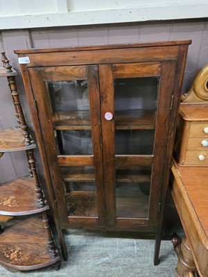 Lot 62 - A stained pine glazed two door cabinet