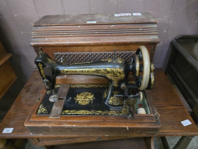 Lot 66 - A cased Singer manual sewing machine