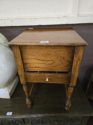 Lot 69 - A mid-20th century oak sewing box with lift up...