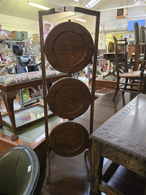 Lot 74 - An early 20th century three tier oak cake stand