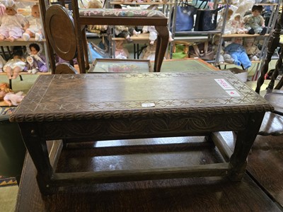 Lot 75 - An early 20th century carved low level...