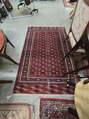 Lot 82 - A red ground rectangular eastern rug`