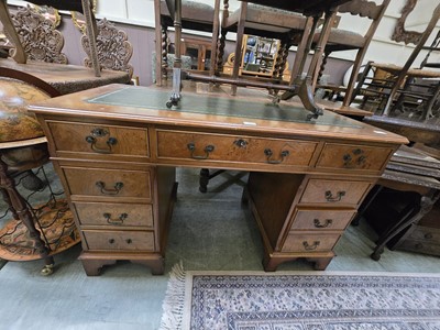 Lot 97 - A reproduction yew twin pedestal desk with...