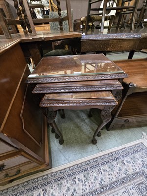 Lot 99 - A nest of three reproduction walnut occasional...