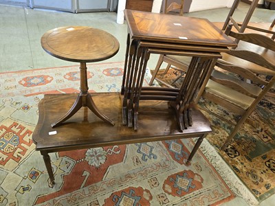 Lot 24 - A reproduction nest of mahogany tables with a...