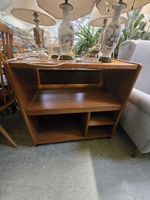 Lot 125 - A mid-20th century teak cabinet having various...