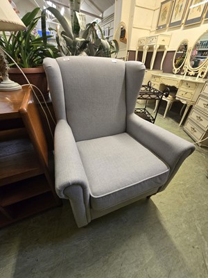 Lot 127 - A modern pale blue upholstered wing armchair