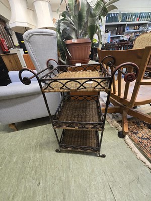 Lot 128 - A wicker and metalwork three tier stand