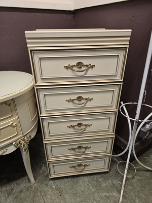 Lot 132 - A cream and gilt painted five drawer chest of...