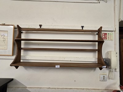 Lot 144 - A light Ercol wall mounted plate rack