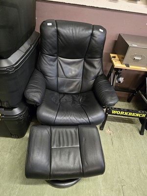 Lot 149 - A black upholstered Ekornes stressless swivel...