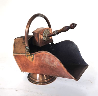 Lot 30 - A Victorian copper coal scuttle with shovel