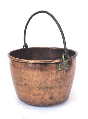 Lot 31 - A brass and copper cauldron with metal handle