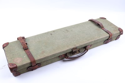 Lot 1424 - Canvas and leather gun case, fitted interior...