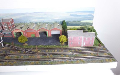 Lot 186 - An N gauge train layout including street scene,...