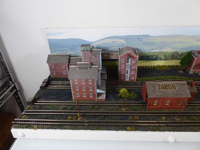 Lot 186 - An N gauge train layout including street scene,...