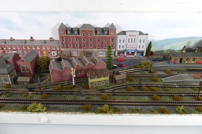 Lot 186 - An N gauge train layout including street scene,...