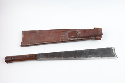 Lot 86 - A 14 ins tapanga style machete, with leather...