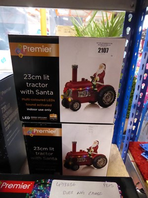 Lot 2107 - 2 23cm pre-lit tractors with Santa