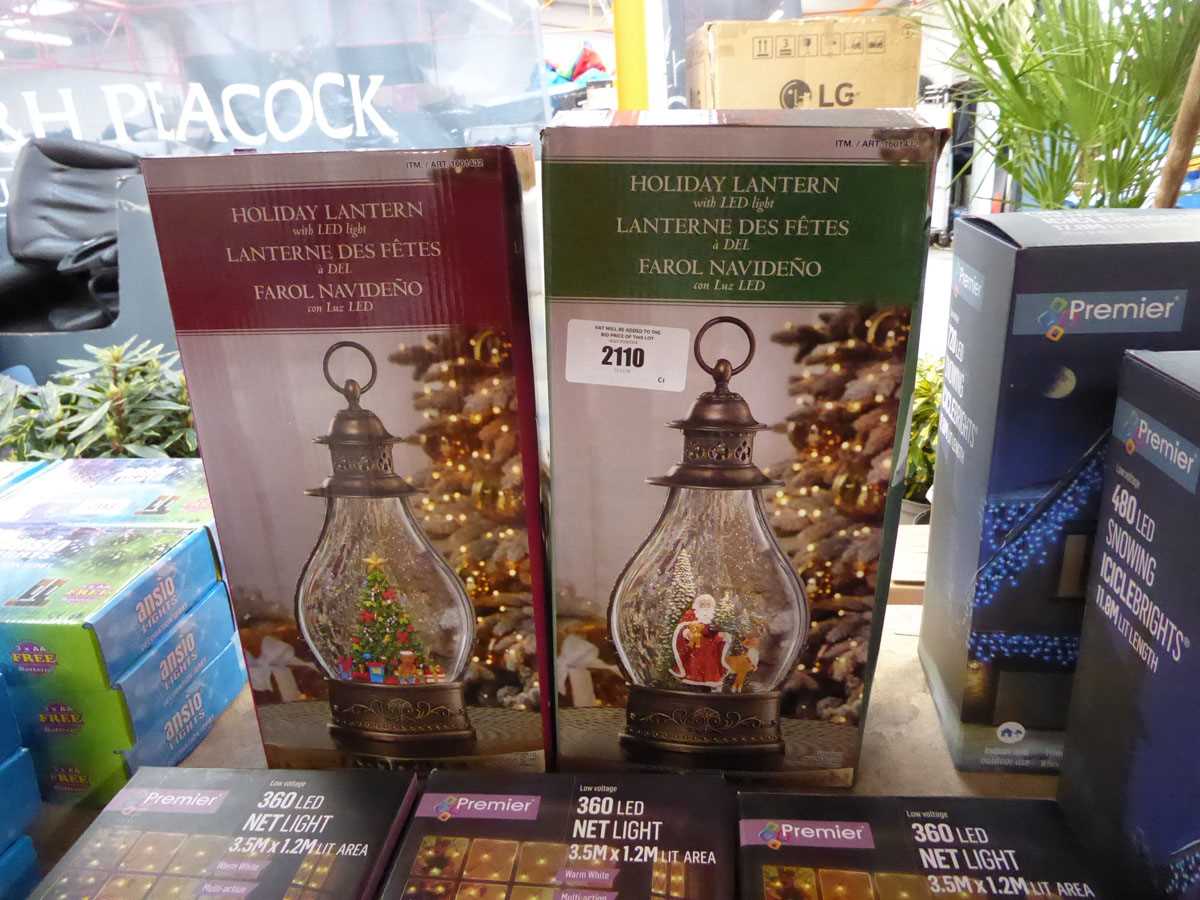 Lot 2110 - 2 battery operated LED snow globe style lanterns