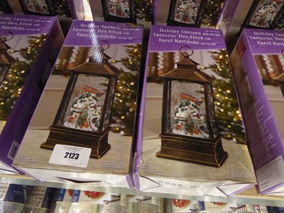 Lot 2123 - 2 Christmas themed battery operated snow globe...