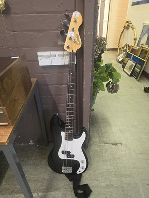 Lot 5 - An Encore electric bass guitar