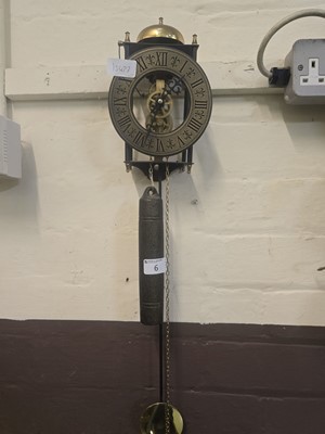 Lot 6 - A reproduction skeleton wall clock