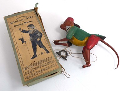 Lot 200 - A German tinplate 'Climbing Monkey' toy, boxed