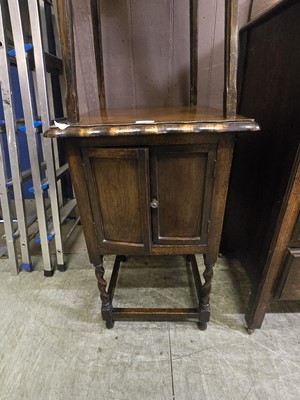 Lot 43 - A mid-20th century oak two door cupboard on...