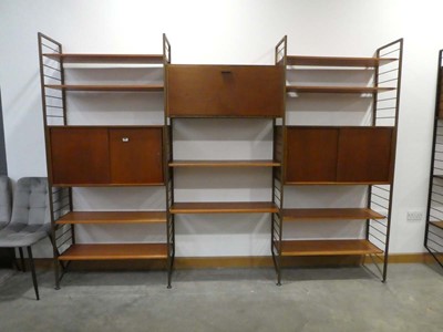 Lot 5037 - A modular shelving system including teak...