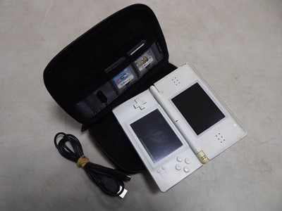 Lot 2138 - Nintendo DS with charging cable and 2 games,...