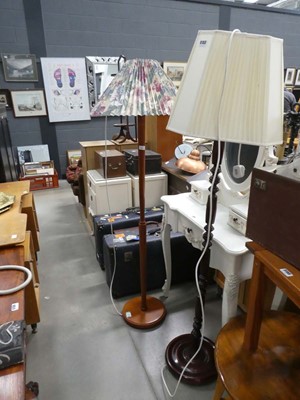 Lot 5153 - Two turned wooden floor lamps with pleated shades