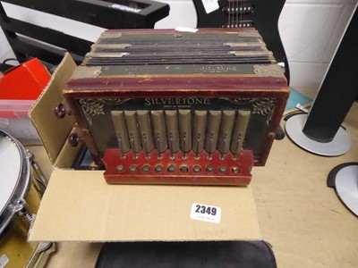 Lot 2349 - Silver tone squeeze box and repair kits