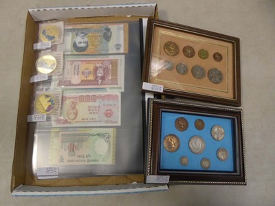 Lot 2469 - Two folders of various banknotes, with...