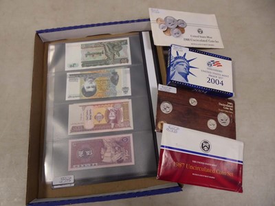 Lot 2470 - 2 folders of various banknotes with coins and...