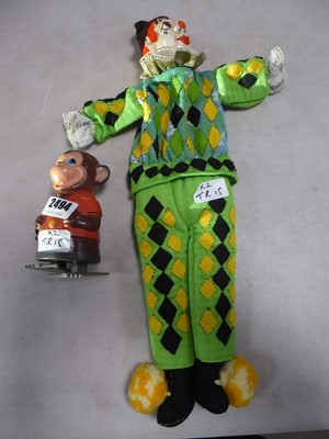 Lot 2494 - Tin toy monkey and a puppet clown