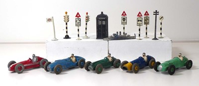 Lot Five Dinky racing cars, a Police box, a ship...