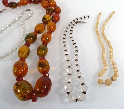 Lot 515 - An amber-type graduated bead necklace, l. 60...