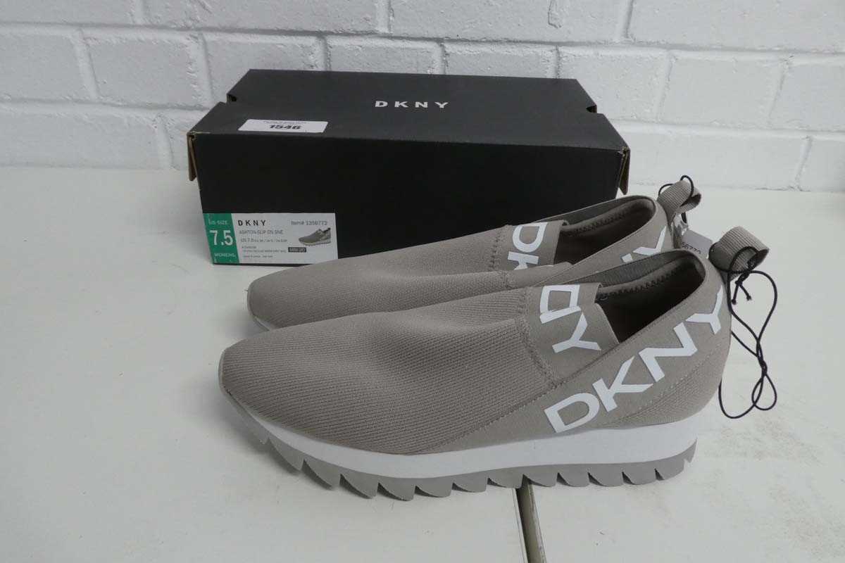 Lot 1546 - Boxed pair of ladies DKNY slip on trainers in...