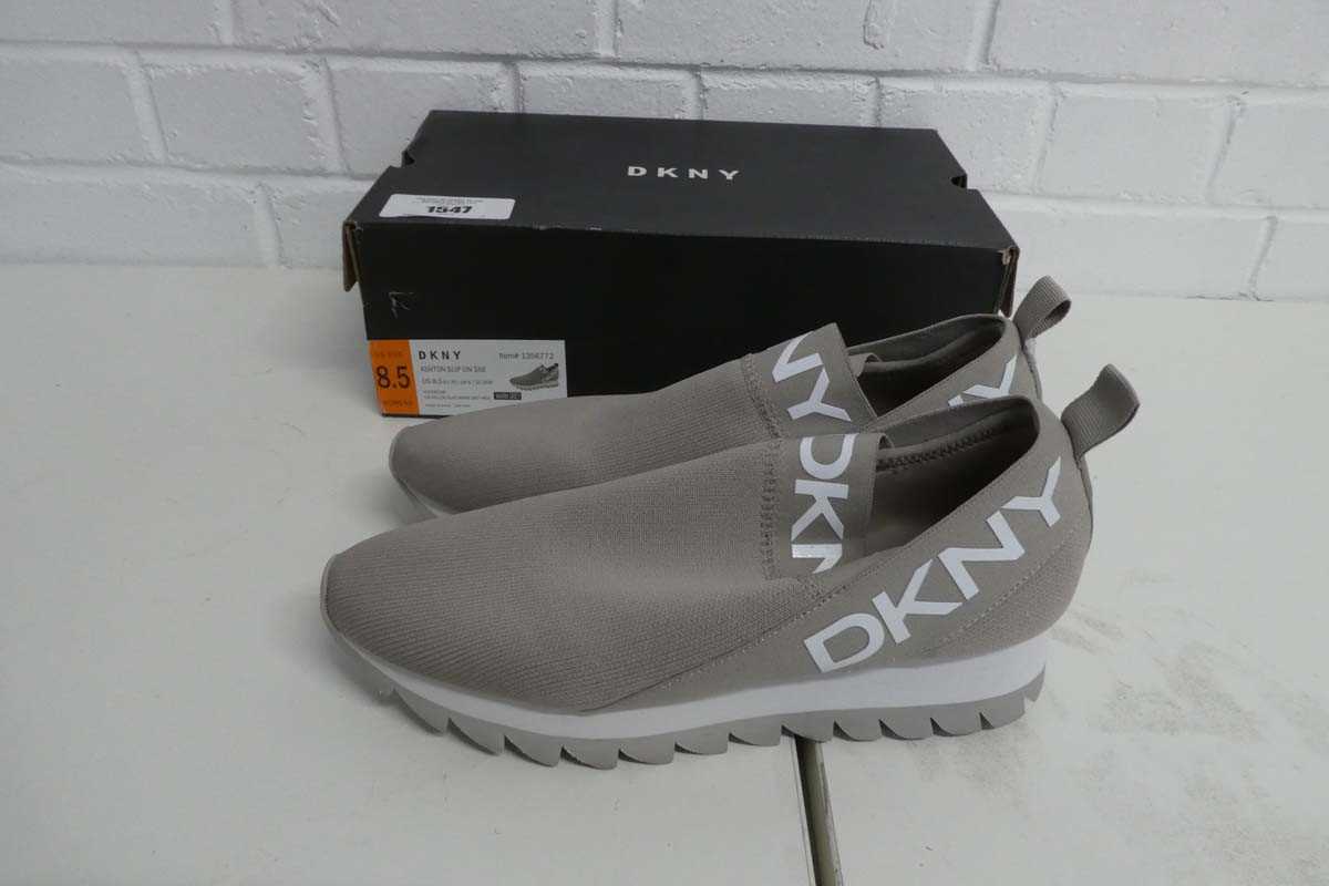 Lot 1547 - Boxed pair of ladies DKNY slip on trainers in...