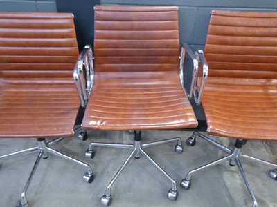 Lot 5033 - Chromed swivel armchair with leather seat in...