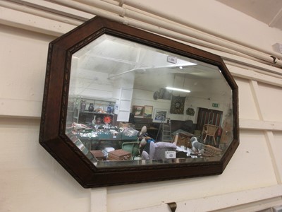 Lot 68 - An early 20th century oak bevel glass mirror