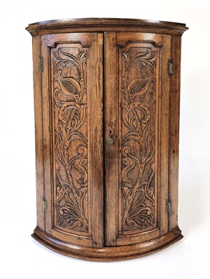 Lot 3 - An early 19th century oak barrel-fronted...