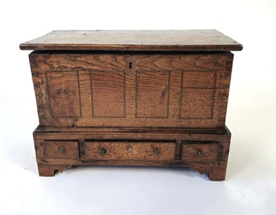 Lot 7 - A Georgian miniature oak coffer, possibly an...