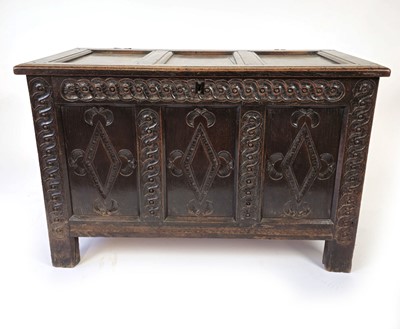 Lot 9 - An 18th century oak panelled coffer, the three...