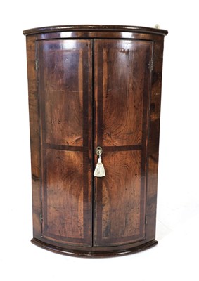 Lot 14 - An 18th century walnut and banded barrel-front...