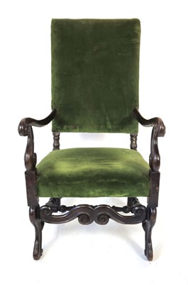 Lot 18 - A walnut and upholstered highback armchair...