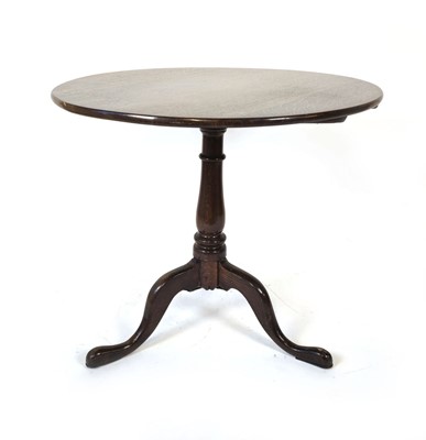 Lot 20 - An 18th century oak supper table, the tilt-top...