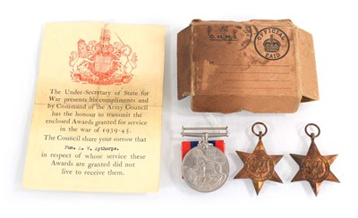 Lot 109 - A boxed group of three Second World War medals...